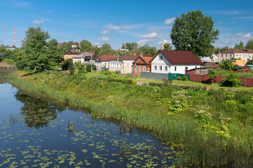 View of residential buildings on Mikhail Ushakov embankment and Kashinka River. Kashin city. Tver region