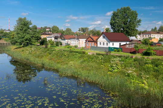 View of residential buildings on Mikhail Ushakov embankment and Kashinka River. Kashin city. Tver region