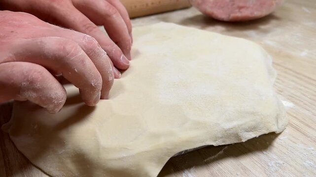 Hands gently shape dough over a pie dish, evoking a cozy kitchen atmosphere, perfect for autumn baking or Thanksgiving preparations, inviting creativity in pastry making