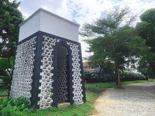 Small Pebble Stone Building beside Garden Pathway