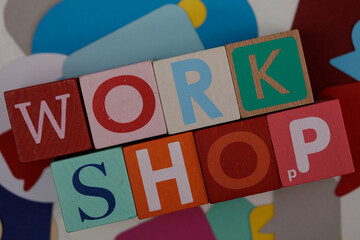 Vibrant image showcasing the word 'Workshop' spelled out with wooden letter blocks. Great for educational and business concepts, highlighting le