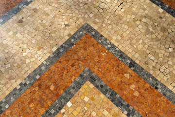 Mosaic tile floor with a black and white stripe