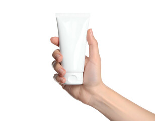 A hand holding a white, unmarked tube against a solid black background