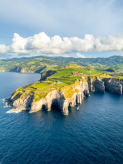 Cape Cintrao, Cliffs, Green Lush Hills, Fields, Pasturelands and Atlantic Ocean. Azores, Sao Miguel Island. Portugal. Aerial View