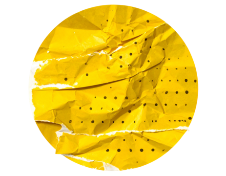A bright yellow crumpled paper circle with dark dots and white space against a black background