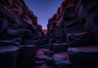 Moody twilight in a martian like desert canyon with smooth basalt rock formations