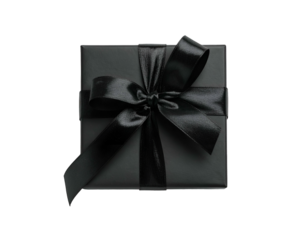 A square, wrapped present featuring a black satin bow against a stark, black backdrop