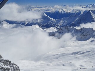 Snow covered mountain top in Austria. View of the Alps from the Zugspitze, the highest mountain in Germany