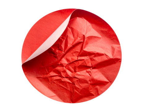 Circular view of a crimson, textured paper, with a corner peeled back, against a black background