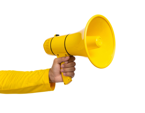 A person's arm in yellow, holding a bright yellow megaphone, isolated on a black background