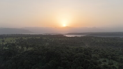 Fototapeta premium Sunrise over the clouds