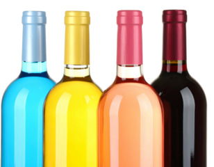 Four vibrant wine bottles with colorful foil tops, various hues, isolated on black background