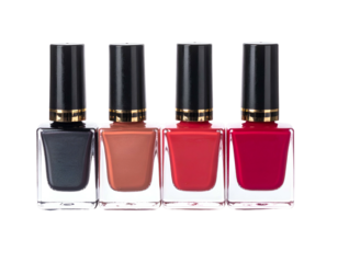 Four nail polish bottles in varying shades of red, orange, and dark grey, in a row