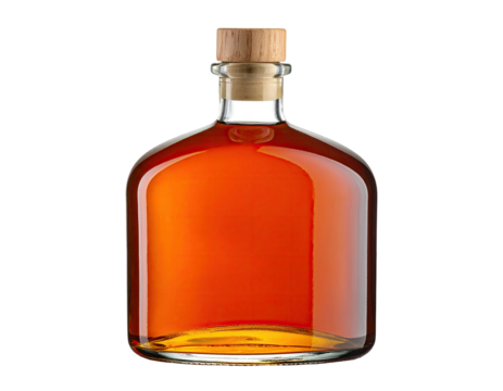 Bottle of amber-colored liquid with a wooden cork, set against a black background