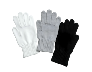 Three knitted gloves, white, gray, and black, lie casually on a plain black background