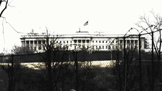 United states capitol building behind security fence