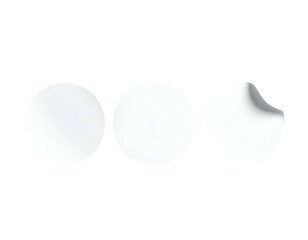 Three white circular stickers, one with a corner peeled back, arranged horizontally on black