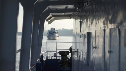 Cargo ship sailing on a calm river. Clip