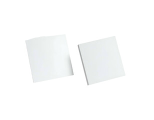 Two plain, white, square-shaped objects, possibly pads of paper, isolated on a black background