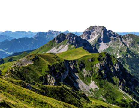 A vast mountain range, showcasing lush, green slopes leading to peaks under a clear blue sky