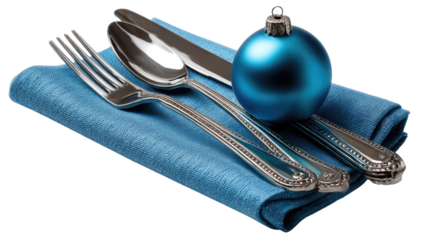 Festive Table Setting: A classic table arrangement presents a blue bauble in the centerpiece and gleaming silverware, evoking the holiday season.