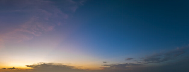 Getting dark at sundown. Sunset sky with scattered clouds of bright colors