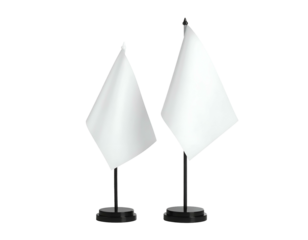 Two white flags on black stands, against a dark background