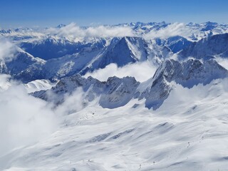 Snow covered mountain top in Austria. View of the Alps from the Zugspitze, the highest mountain in Germany