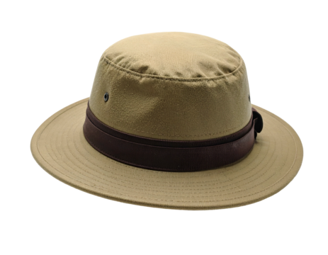 A tan outdoor hat with a brown band sits isolated against a black background