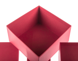 Overhead close-up view of an open, angular, red cardboard box against a black background
