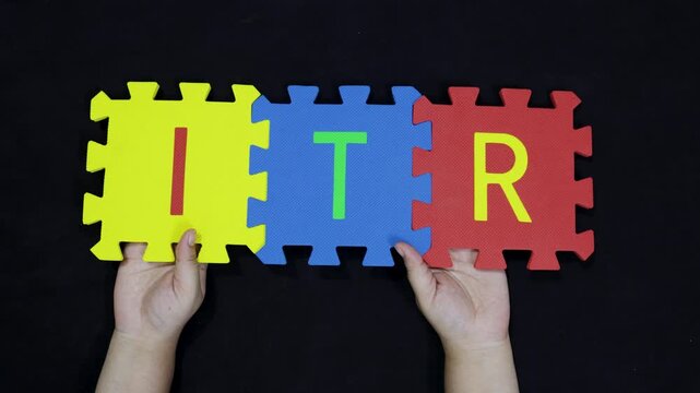 finance and taxation word itr on colorful puzzle pieces