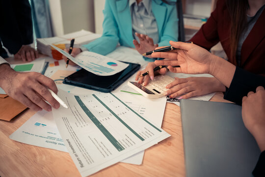 Data analysis meeting with business team using laptops and digital charts for strategic planning. With digital tablets and business graphs with data working in the office.