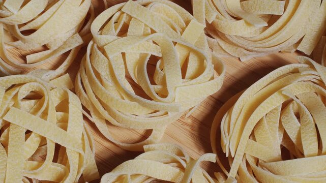 Italian tagliatelle pasta packaging window, Fettuccine pasta, close up, not cooked