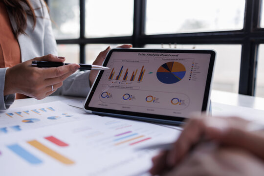 Calculating electronic medical accounts and codes in a black office using a spreadsheet on a computer screen.

