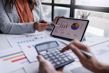 Calculating electronic medical accounts and codes in a black office using a spreadsheet on a computer screen.

