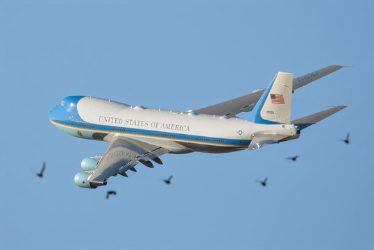 Ben Gurion Airport, Israel &ndash; 10.13.2025: Air Force One Boeing VC-25A (92-9000) Taking Off After Donald Trump&rsquo;s Surprise Visit to Israel with birds flock aligned with the aircraft in the foreground 