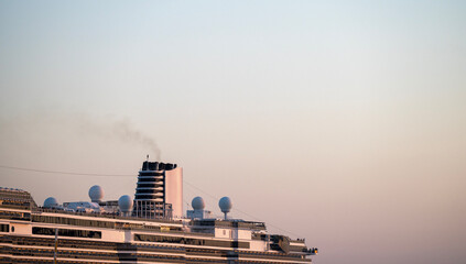 Cruise Ship Funnel with Smoke at Sunset