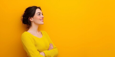 Model's head raised and looking forward,smiling,arms crossed,copy space,yellow background,banner
