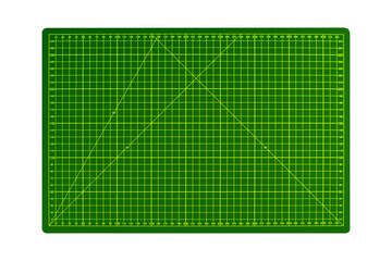 Green A3 cutting mat with yellow measurement grid is isolated.