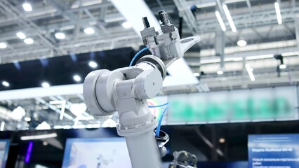 Robotic arm moving in a technological environment. Media