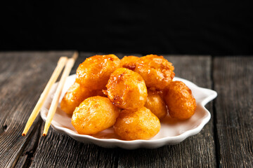 Pineapple pieces fried in caramel.Dessert. Food concept