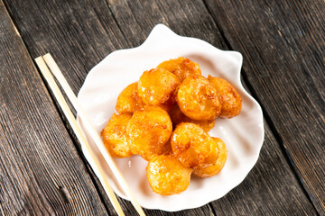 Pineapple pieces fried in caramel.Dessert. Food concept