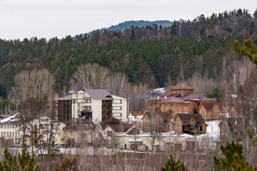 A tourist base nestled among the trees in the mountains in winter.