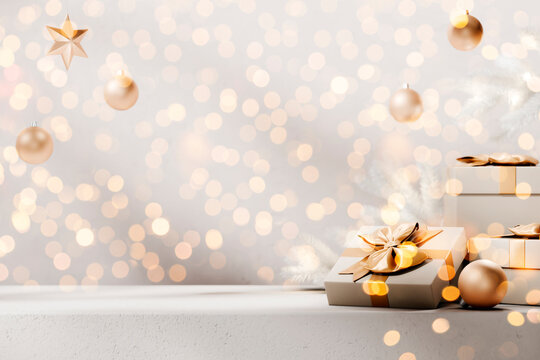 Christmas background with golden christmas presents and ornaments on empty table. New year holiday present box with bokeh lights. Minimal winter festive mockup.