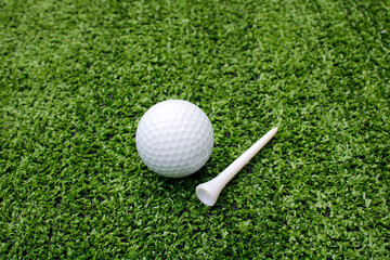 Golf Ball and Tee on Artificial Turf for Sports and Recreation