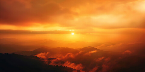 Obraz premium Stunning sunset over mountain range with clouds