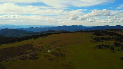Obraz premium Aerial view flying over green mountain plateau. Media
