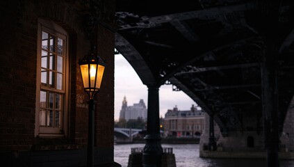 Fototapeta premium A streetlight near a railway bridge at Kew