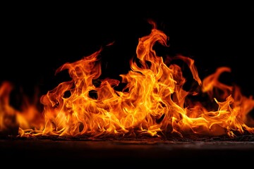 A realistic photo of fire flames with illuminated edges on a black background.