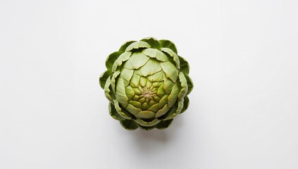 Fototapeta premium Creative arrangement of green artichoke on a white surface. Overhead view. Culinary theme.